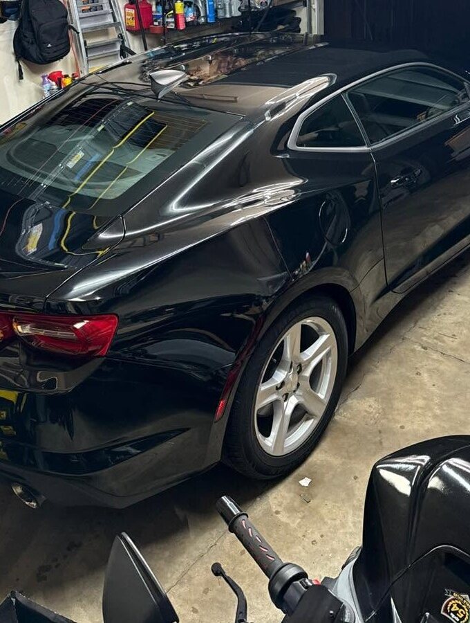 Black Chevrolet Camaro with a deep shine