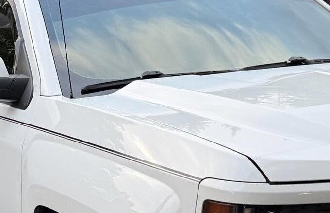 Clean white hood of a Chevrolet Silverado