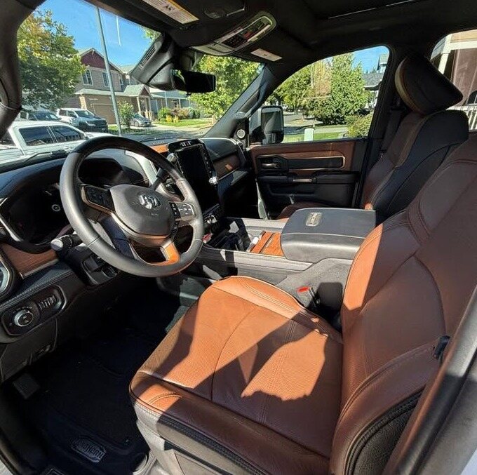 Ram pickup dash and tan leather seats after an interior detail