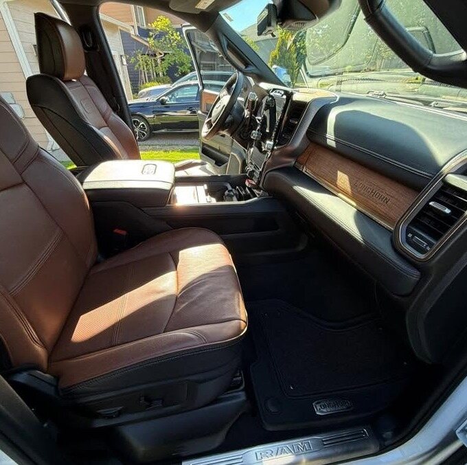 Ram pickup front seats and console, vacuumed and wiped down