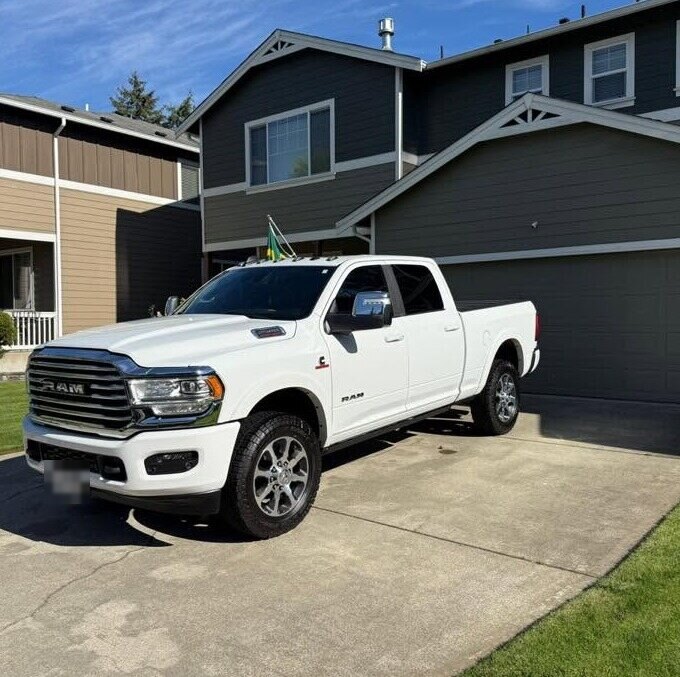 White Ram pickup, freshly detailed in a driveway