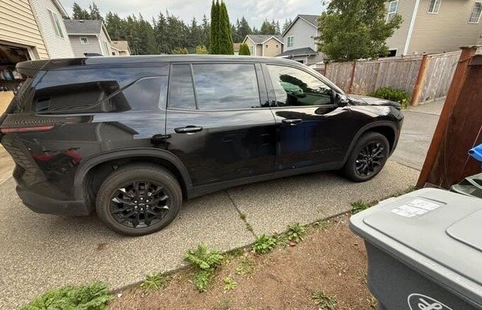 Black SUV in a driveway after an exterior detail