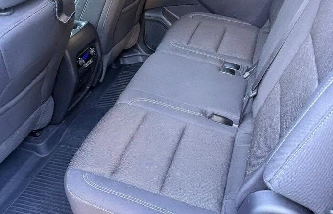 Clean grey cloth rear seats in an SUV