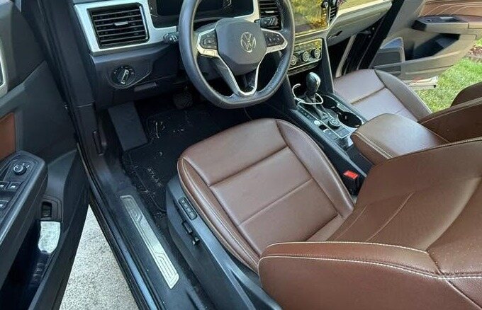 Brown leather driver seat and clean carpet